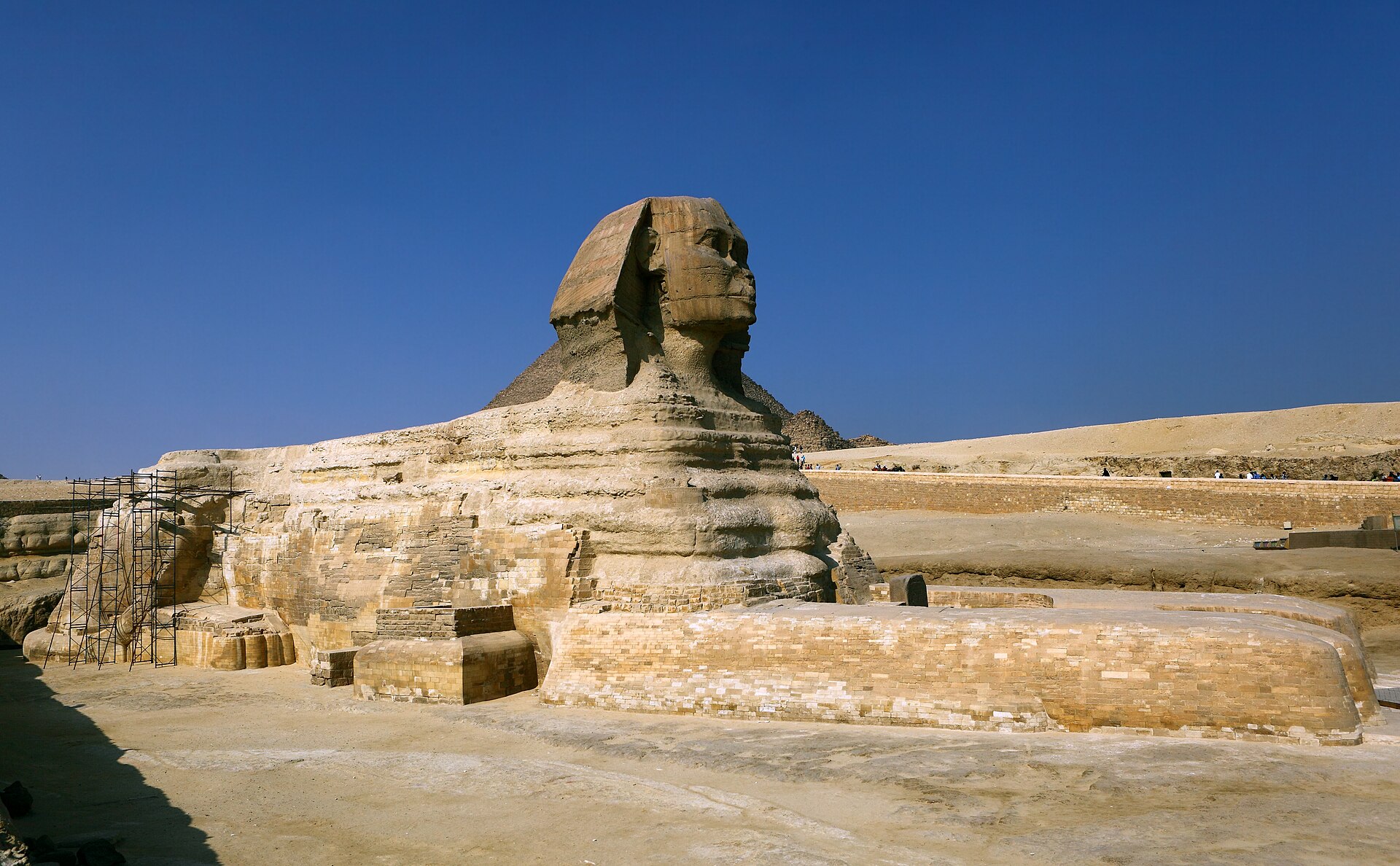 Coptic monastery walls rising from Wadi Natrun desert depression